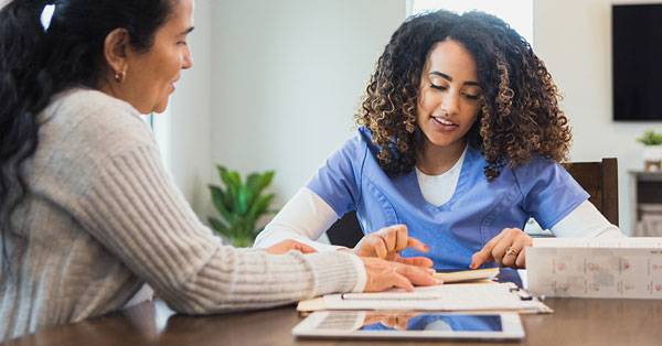 Medical professionals reviewing charts