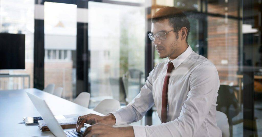 man works at desk