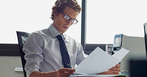 Business man reviewing paperwork