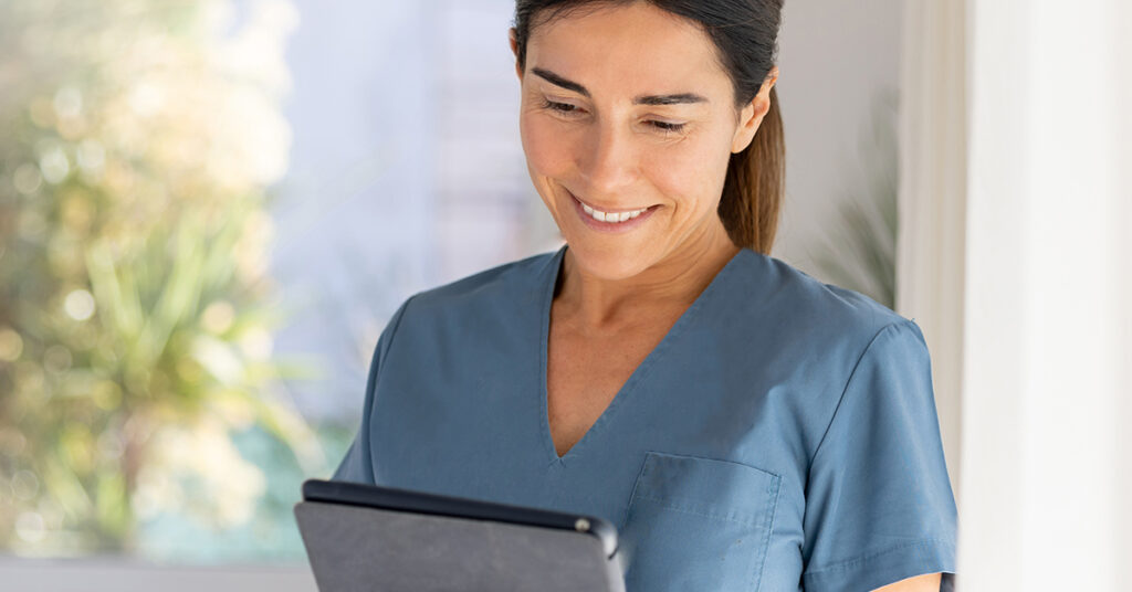 healthcare professional uses mobile tablet