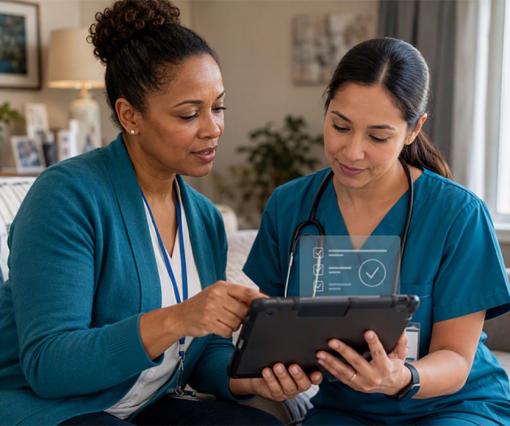 Two clinicians in teal scrubs review a completed checklist on a tablet
