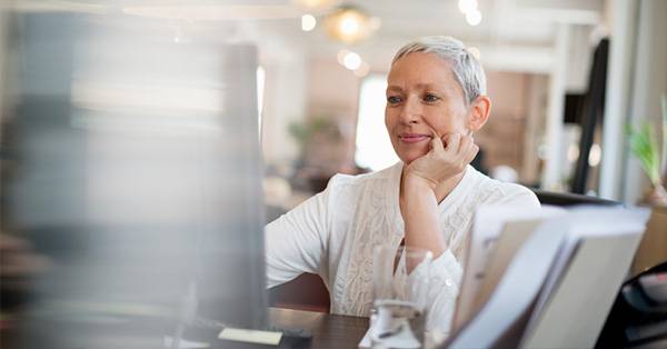 female medical professional staring at computer screen