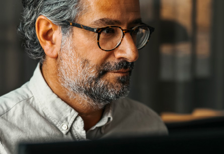 Man with beard looking to the right